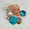 broche trésors de l'ocean avec oxydes et perles synthétique