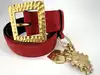 ceinture vintage yves saint laurent en cuir suédé rouge avec pendentif soleil et coeur, boucle martelée dorée taille 85/34
