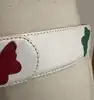 ceinture yves saint laurent en cuir blanc et papillons taille 85/34 référence 8966