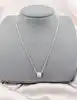chaîne or blanc orné d'un pendentif rouleau entièrement pavée de petits diamants or 750 millième (18 ct) 5,42g