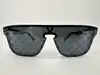 lunettes de soleil louis vuitton waimea noir monogram z1082w avec détails cloutés en métal argenté