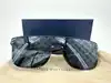 lunettes de soleil louis vuitton waimea noir monogram z1082w avec détails cloutés en métal argenté