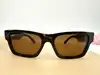 lunettes de soleil prada spr 25z 2au-0b0 monture écaille et verres marron