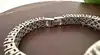 montre bracelet vintage en argent et grenats naturels, cadran nacre, mouvement quartz  argent 925 millième (22 ct) 44,91g