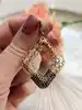 pendentif motifs ajourés serti de pierres marrons or 750 millième (18 ct) 3,91g