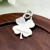pendentif tiffany & co en forme de trèfle  argent 925 millième (22 ct) 6,12g