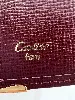 porte-cartes cartier must en cuir bordeaux avec finition dorée