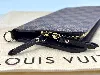 portefeuille long / organiser louis vuitton insolite en toile damier ébène