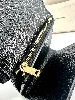portefeuille saint laurent en cuir noir matelasé grain de poudre avec logo doré