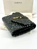 portefeuille saint laurent en cuir noir matelasé grain de poudre avec logo doré