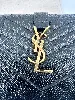 portefeuille saint laurent en cuir noir matelasé grain de poudre avec logo doré