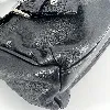 sac longchamp en cuir noir et détails argentés