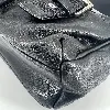 sac longchamp en cuir noir et détails argentés