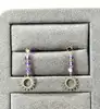 23000470 boucles d’oreilles pendantes ornées de 3 améthystes et d’un motif soleil
