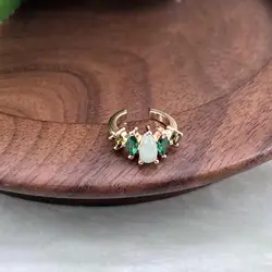 23042850 anneau d'oreille unitaire serti d'oxydes verts