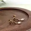 230795014 boucles d'oreilles motif serpent et perle synthétique