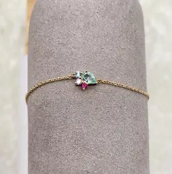 97393418 bracelet plaqué or 4 pierres verte bleue et roses l18 cm