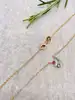 97393445 collier plaqué or 4 pierres verte bleue et roses l 45 cm
