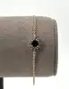 97397018 bracelet centré d'une pierre bleue et entournée des oxydes l18 cm