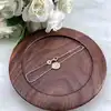 97436418 bracelet avec pendentif rond orné d'oxydes l18 cm