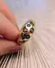 bague bombée sertie d'1 rubis, 5 saphirs, 2 petits diamants et 2 pierres de couleur or 750 millième (18 ct) 9,38g