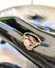 bague cocktail motifs végétaux ornée d'une perle de culture et 3 rubis syntéthiques or 750 millième (18 ct) 3,59g