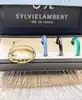 bague sylvie lambert modulable avec 3 anneaux de couleur en résine or 750 millième (18 ct) 1,49g