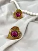 boucles d'oreilles clip yves saint laurent motif coeur doré et pierre rose