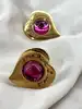 boucles d'oreilles clip yves saint laurent motif coeur doré et pierre rose