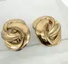 boucles d'oreilles clips dior vintage noeud tourbillon en métal doré