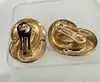 boucles d'oreilles clips dior vintage noeud tourbillon en métal doré