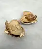 boucles d'oreilles clips vintage christian lacroix coeur et étoile en métal doré et résine ambre