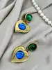 boucles d'oreilles pendantes clip vintage yves saint laurent motif coeurs verts, bleus et dorés