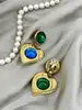 boucles d'oreilles pendantes clip vintage yves saint laurent motif coeurs verts, bleus et dorés