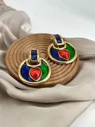 boucles d'oreilles pendqntes clip yves saint laurent en métal doré