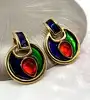 boucles d'oreilles pendqntes clip yves saint laurent en métal doré