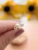 boucles d'oreilles puces chacune ornée d'une perle de culture diamètre 5mm or 375 millième (9 ct) 0,65g