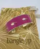 bracelet jonc large bangle up émail rose fuchsia et éclairs dorés