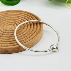 bracelet pandora jonc fermoir cœur infini moments argent 925 millième (22 ct) 9,18g