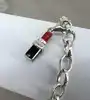 bracelet thomas sabo avec 3 charms ( rouge à lèvres, coeur, flacon de vernis à ongles ) argent 925 millième (22 ct) 16,46g