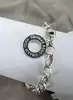 bracelet thomas sabo avec 3 charms ( rouge à lèvres, coeur, flacon de vernis à ongles ) argent 925 millième (22 ct) 16,46g