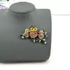 broche hiboux sur branche pavée d'oxydes