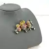 broche hiboux sur branche pavée d'oxydes