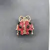 broche motif coccinelle pavée d'oxydes