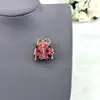 broche motif coccinelle pavée d'oxydes