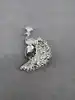 broche motif paon sertie d'oxydes bleus