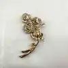 broche plume de paon pavée d'oxydes