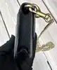 coach mini sac en cuir grainé noir avec chaîne dorée amovible