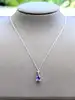 collier en or blanc avec pendentif tanzanite surmontée d'un diamant or 750 millième (18 ct) 2,63g