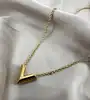 collier louis vuitton essential v en laiton à finition dorée